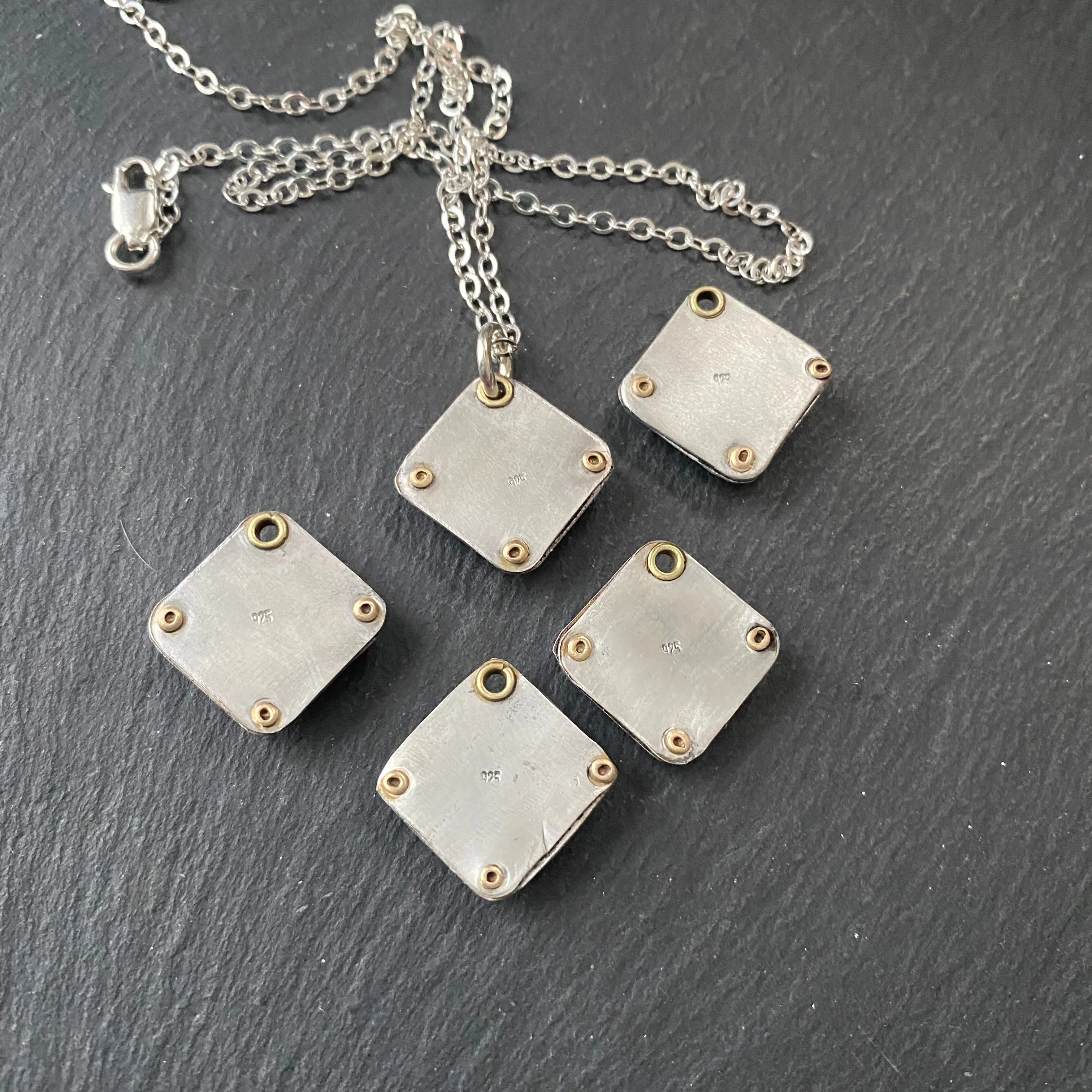 Square Turquoise necklace hand crafted from sterling silver and genuine square Kingman turquoise with golden brass accents