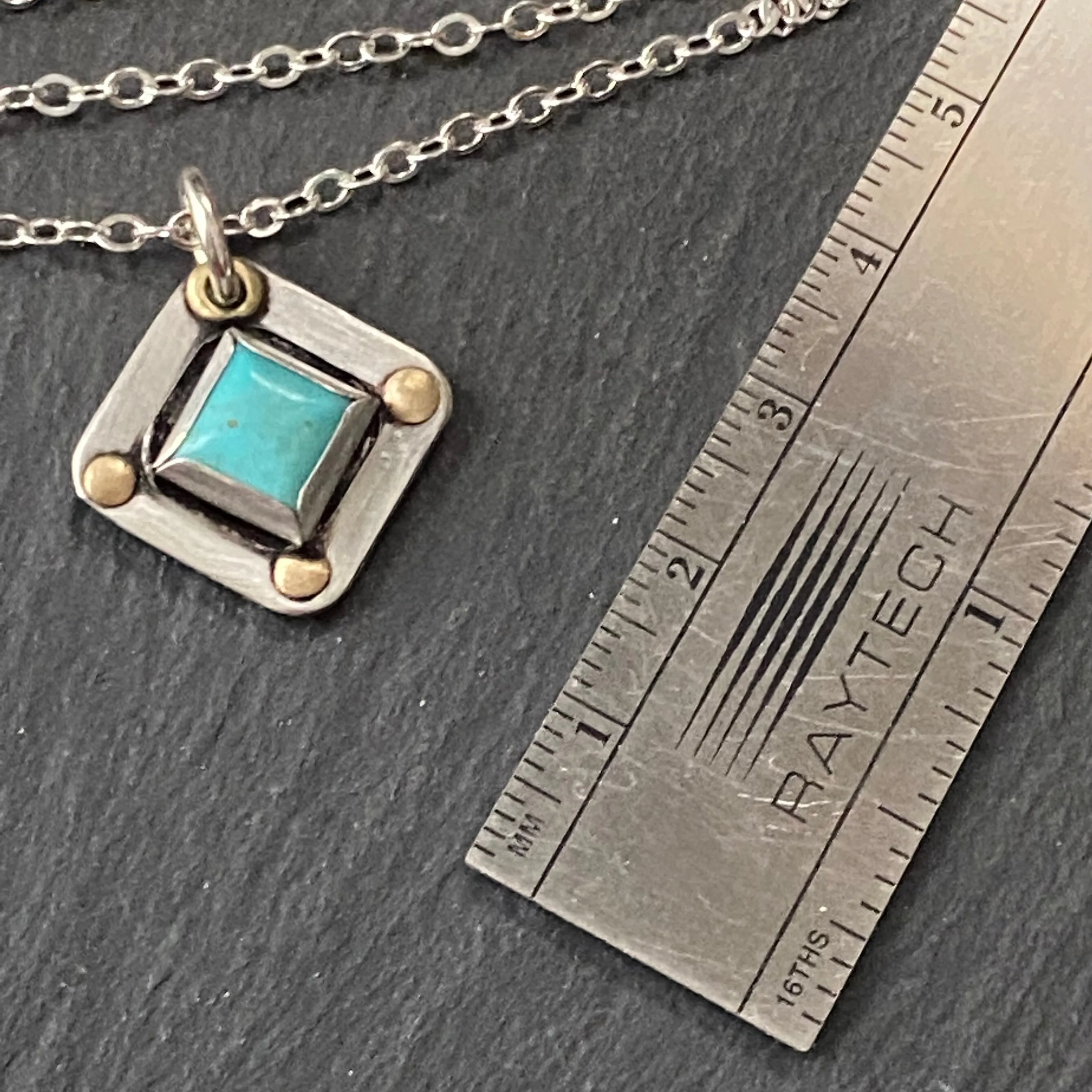 Square Turquoise necklace hand crafted from sterling silver and genuine square Kingman turquoise with golden brass accents